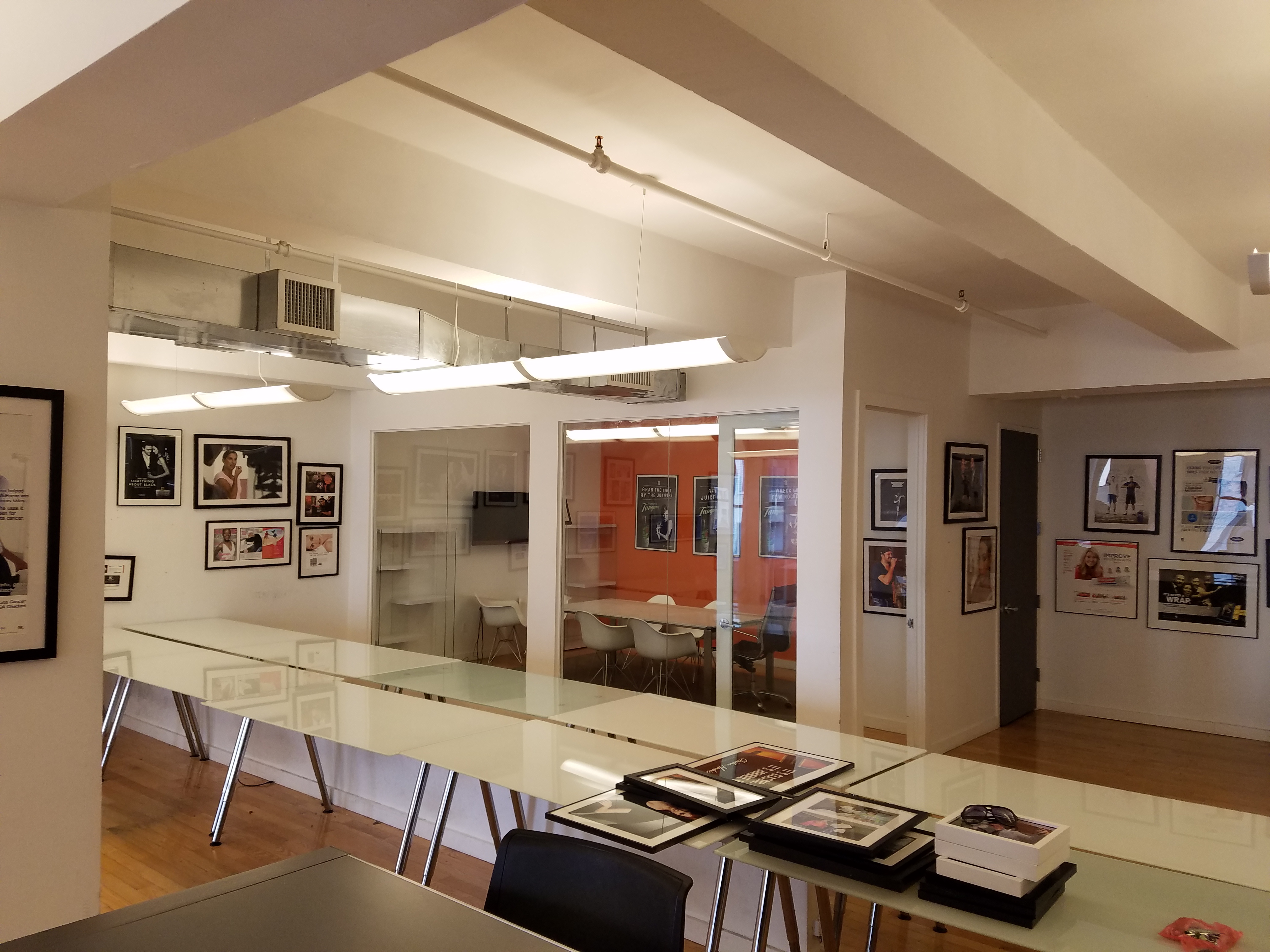 Exposed ceilings, hardwood floors, furnished office space